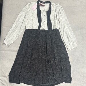 Stylish Black and White Polka Dot Dress with Buttons and Bow
